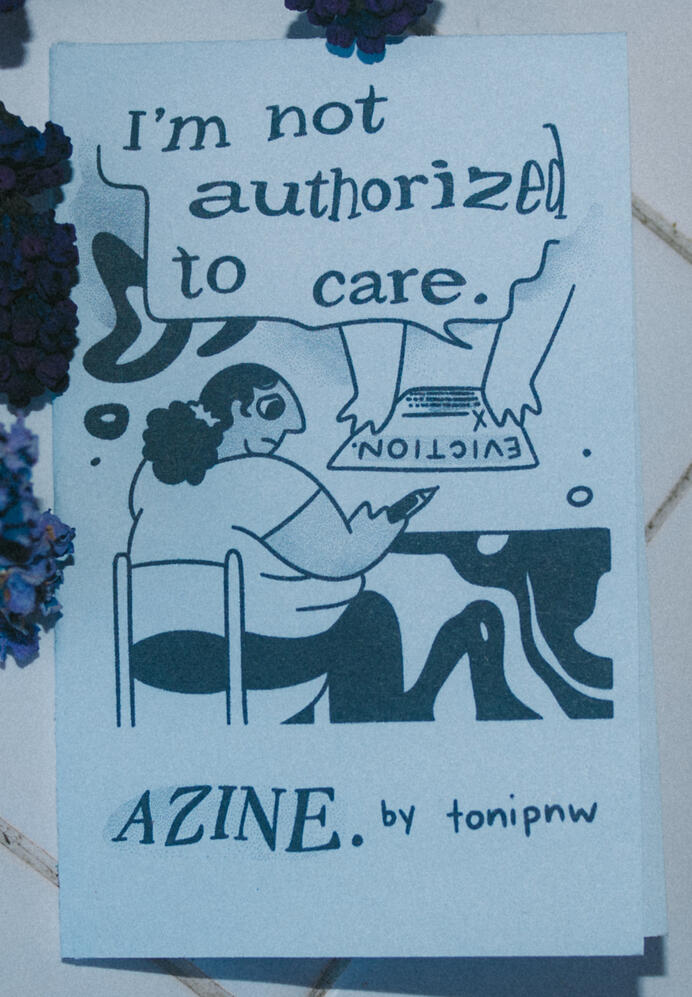 Untitled A photo of a zine cover depicting a person with a sad look sitting at a desk. An unseen person opposite the main figure is holding an eviction notice. This zine is titled "I'm not authorized to care."