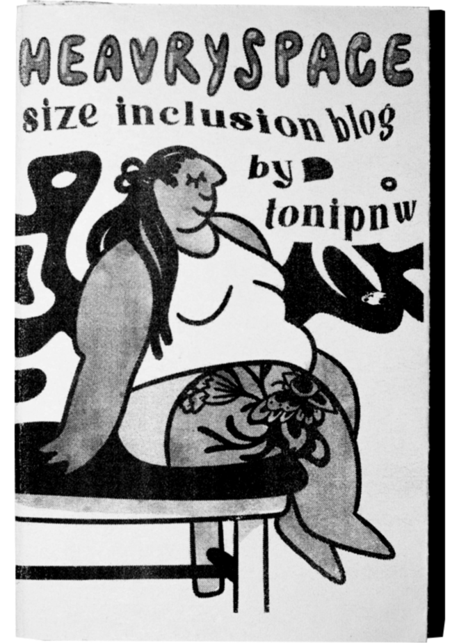 A scan of a zine cover. A drawn figure sits on a stationary tattoo/massage table. The figure has a large tattoo on their knee and thigh. The background has black waves and the top on the page says "heavryspace size inclusion blog by tonipnw"